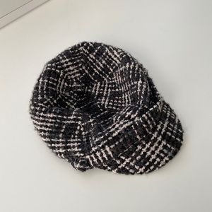 Black and white houndstooth cap